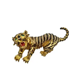 Golden panther brooch with green rhinestones and black enamel, vintage jewelry.