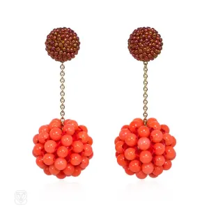 Long cinnamon-colored glass and coral beaded earrings