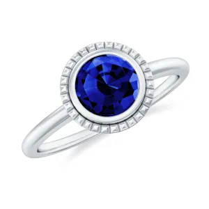 Round Lab-Created Blue Sapphire Solitaire Gold Ring in Bezel Setting